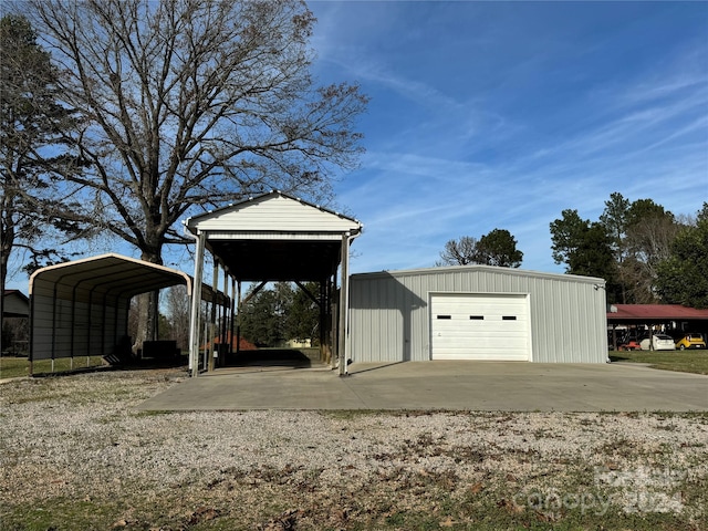 view of outbuilding with a garage and a carport