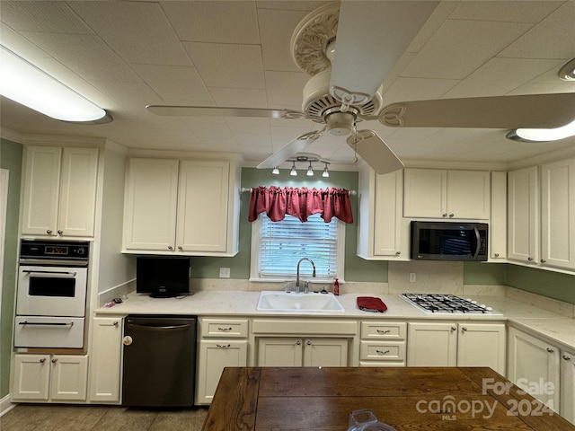 kitchen featuring ceiling fan, white appliances, sink, and light tile patterned floors