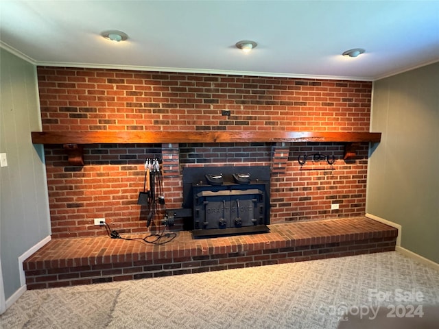 interior details with a wood stove and ornamental molding