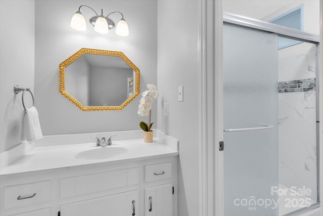 full bathroom with a shower stall and vanity