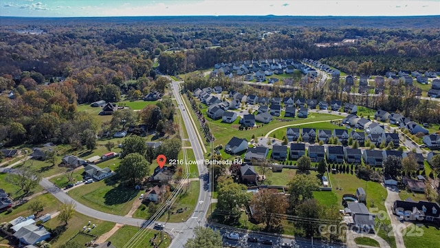 bird's eye view with a residential view and a forest view