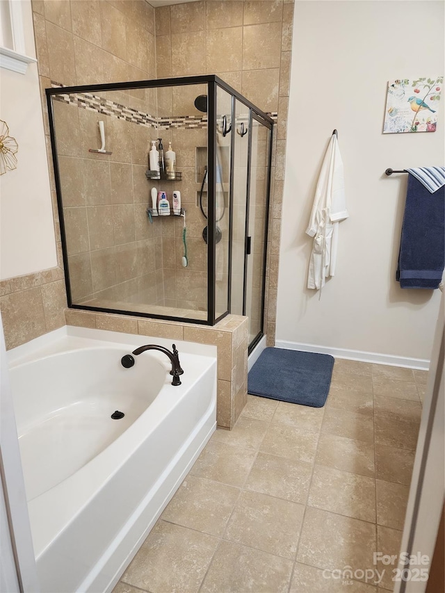 bathroom featuring shower with separate bathtub