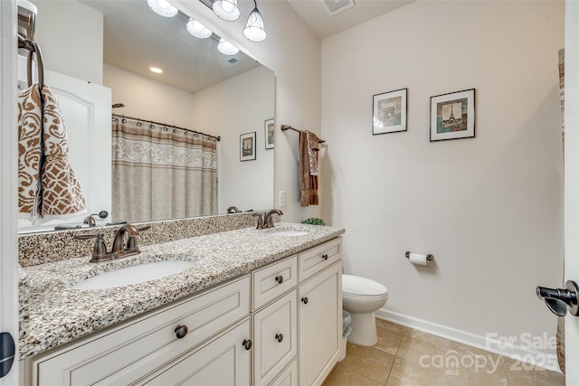 bathroom with toilet, tile patterned flooring, vanity, and curtained shower