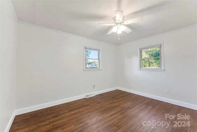 unfurnished room with dark hardwood / wood-style flooring, plenty of natural light, crown molding, and ceiling fan