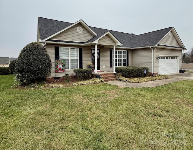 ranch-style house with a garage and a front lawn