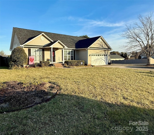 single story home with a garage and a front lawn