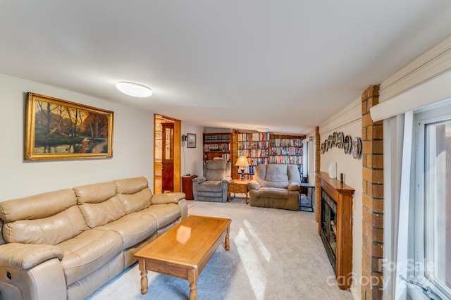 carpeted living room with a fireplace and vaulted ceiling