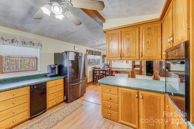 kitchen featuring stainless steel fridge, light hardwood / wood-style floors, ceiling fan, and lofted ceiling