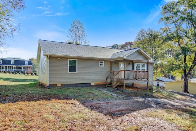 back of property featuring a yard