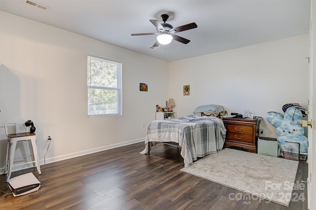 bedroom with ceiling fan and dark hardwood / wood-style floors