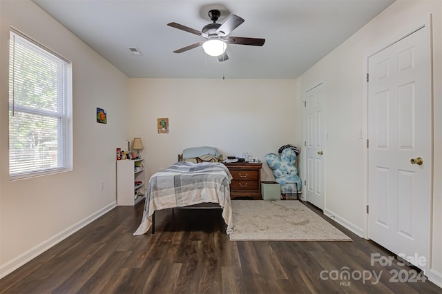 bedroom featuring ceiling fan and dark hardwood / wood-style floors