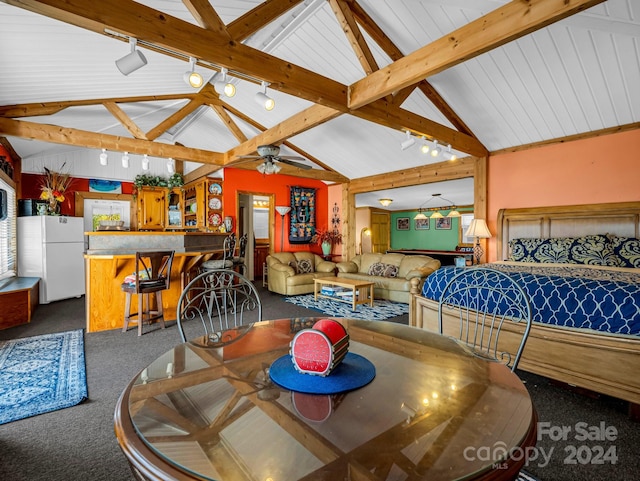 dining space featuring ceiling fan, beamed ceiling, high vaulted ceiling, track lighting, and dark carpet