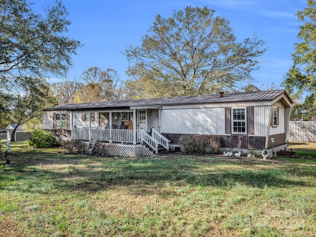 single story home with a porch and a front lawn