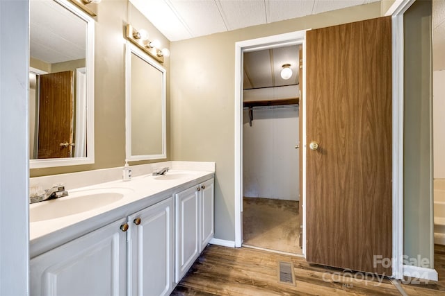 bathroom featuring vanity and hardwood / wood-style flooring