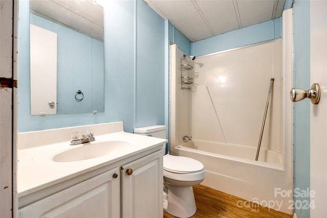 full bathroom with toilet, vanity, bathtub / shower combination, and hardwood / wood-style flooring