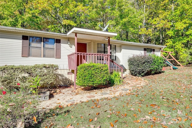 single story home with a porch