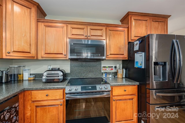 kitchen featuring decorative backsplash and stainless steel appliances