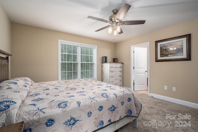 bedroom featuring ceiling fan and light carpet