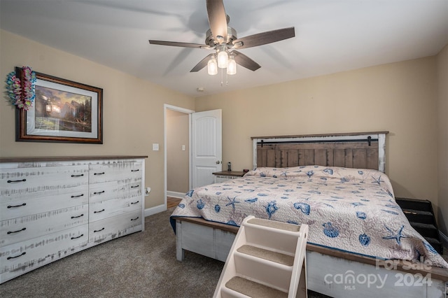 bedroom with ceiling fan and dark colored carpet