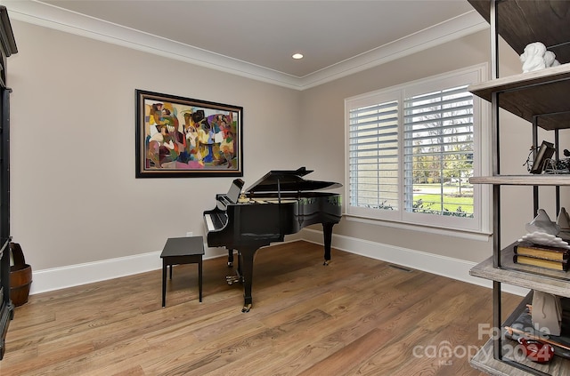 misc room with crown molding and wood-type flooring