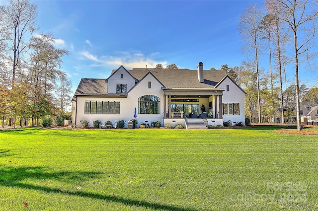 rear view of house with a lawn