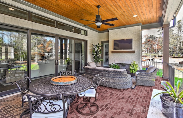 view of patio / terrace featuring ceiling fan