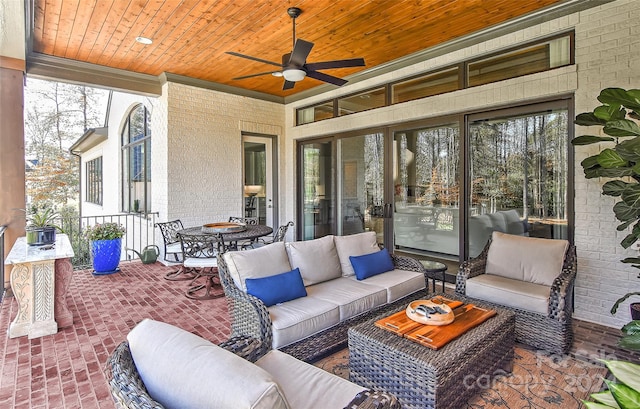 view of patio with an outdoor living space and ceiling fan