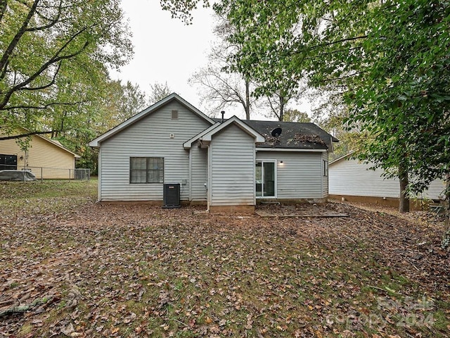 back of property featuring central air condition unit