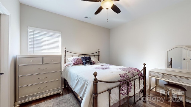 bedroom featuring ceiling fan and dark wood-type flooring