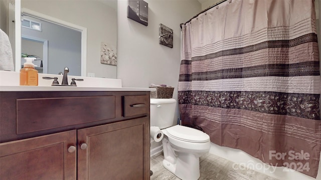 bathroom with hardwood / wood-style floors, vanity, toilet, and walk in shower