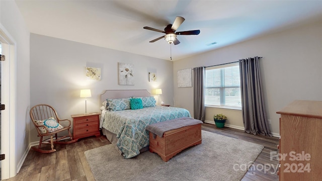 bedroom featuring ceiling fan and wood-type flooring