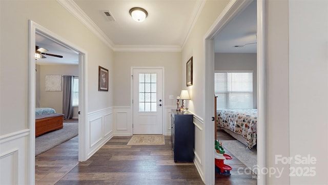 280 Kerri Dawn Ln, Locust, NC 28097 - foyer with dark wood finished floors, ornamental molding, ceiling fan, and wainscoting