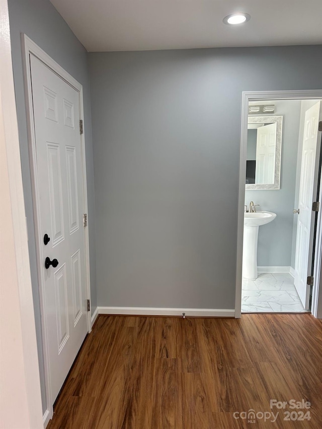 hall with dark hardwood / wood-style flooring