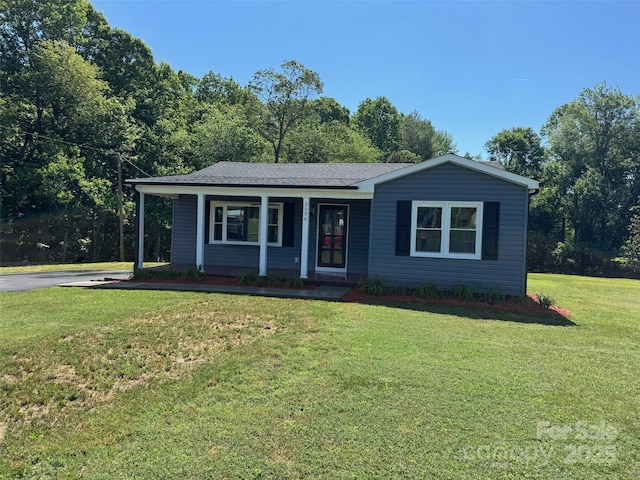 3596 Bethany Church Rd, Claremont, NC 28610 - ranch-style house featuring a front lawn, roof with shingles, and a porch