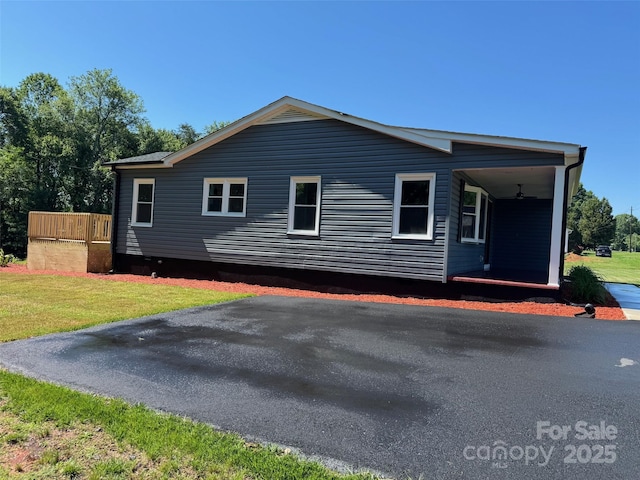 3596 Bethany Church Rd, Claremont, NC 28610 - view of side of home with a lawn