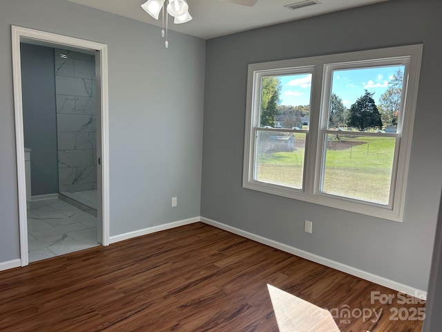 3596 Bethany Church Rd, Claremont, NC 28610 - spare room featuring a ceiling fan, baseboards, and wood finished floors