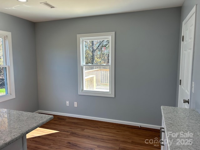 3596 Bethany Church Rd, Claremont, NC 28610 - unfurnished dining area featuring baseboards, healthy amount of natural light, and dark wood-style floors