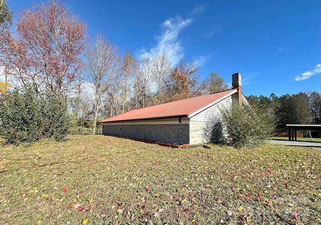 view of home's exterior featuring a lawn