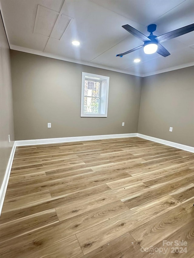 spare room with ceiling fan, light hardwood / wood-style floors, and ornamental molding