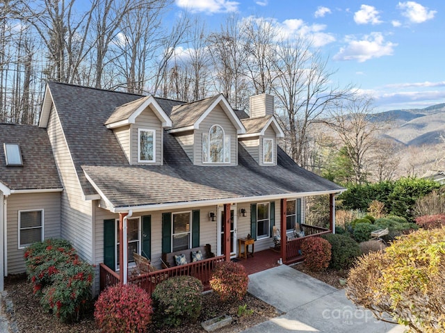 view of front of property featuring a mountain view and a porch