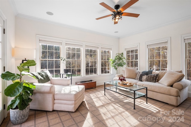 sunroom featuring ceiling fan