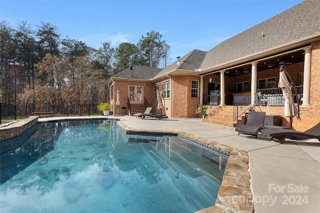 view of pool featuring ceiling fan and a patio