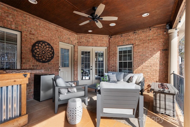 view of patio featuring an outdoor living space, french doors, and ceiling fan