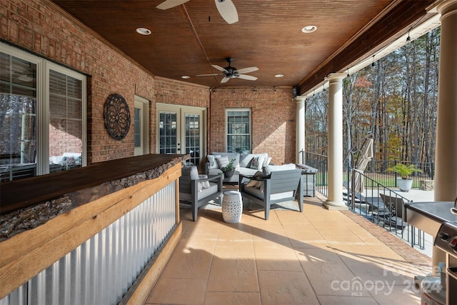 exterior space featuring outdoor lounge area and ceiling fan