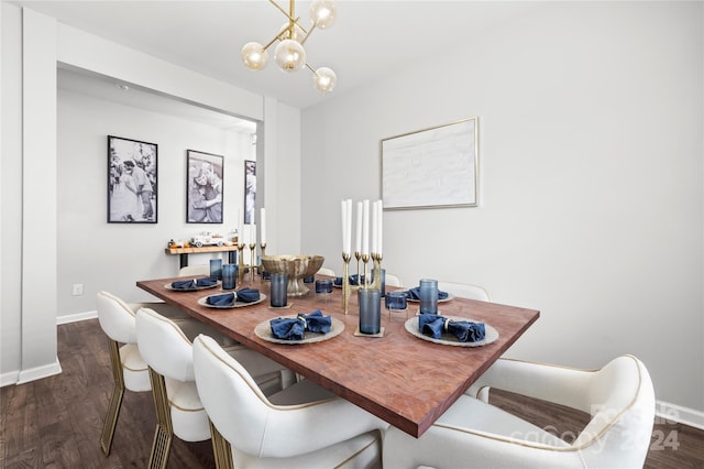 dining area featuring dark hardwood / wood-style floors and a notable chandelier