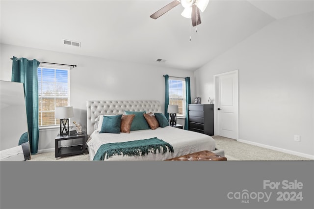 carpeted bedroom featuring vaulted ceiling and ceiling fan