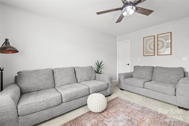 living room featuring carpet and ceiling fan