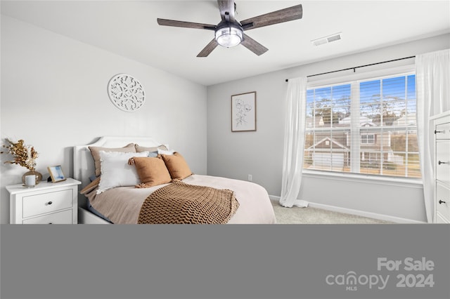 carpeted bedroom with ceiling fan