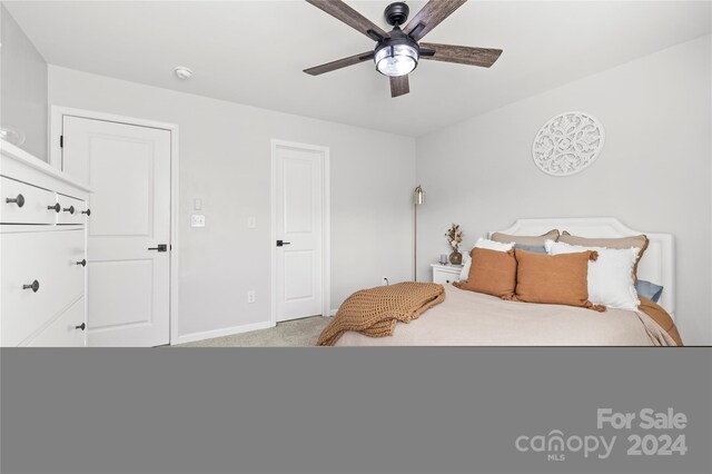 bedroom with light colored carpet and ceiling fan