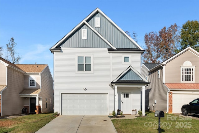 view of front of property with a garage and a front yard